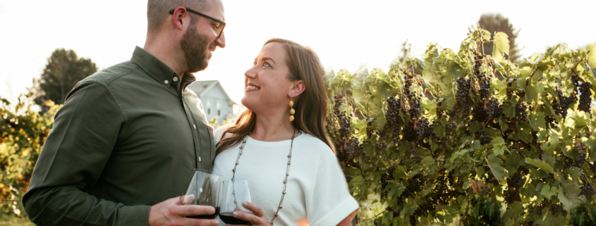 Couple enjoying wine in the vineyards at Mastropietro Winery.