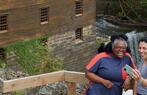 Two women visiting Lantermans Mill in Mill Creek Park in Youngstown, Ohio.